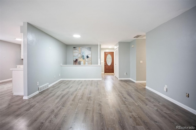 7659 S Holland Way, Littleton, CO 80128 - unfurnished living room featuring wood finished floors and recessed lighting