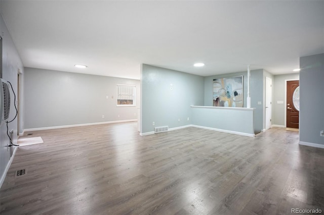 7659 S Holland Way, Littleton, CO 80128 - unfurnished living room featuring wood finished floors and recessed lighting