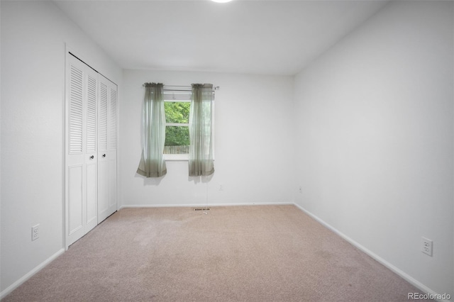 7659 S Holland Way, Littleton, CO 80128 - unfurnished bedroom with carpet flooring and a closet