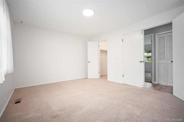 7659 S Holland Way, Littleton, CO 80128 - unfurnished bedroom featuring light carpet and baseboards