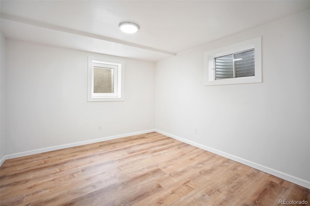 7659 S Holland Way, Littleton, CO 80128 - below grade area featuring wood finished floors and baseboards