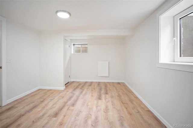 7659 S Holland Way, Littleton, CO 80128 - spare room featuring wood finished floors and baseboards