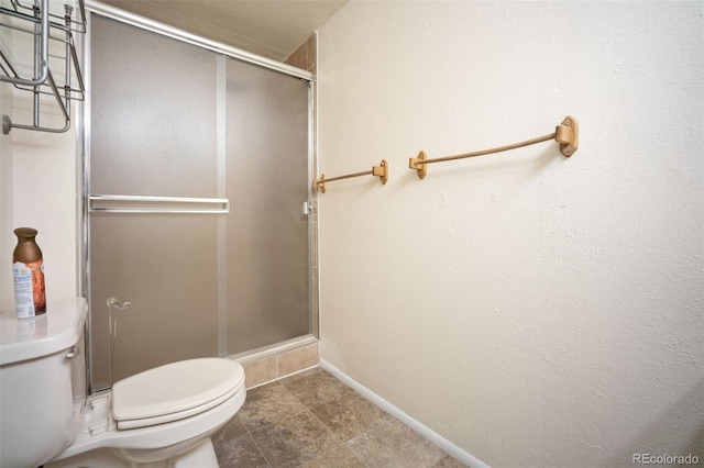 7659 S Holland Way, Littleton, CO 80128 - full bathroom featuring toilet and a shower stall