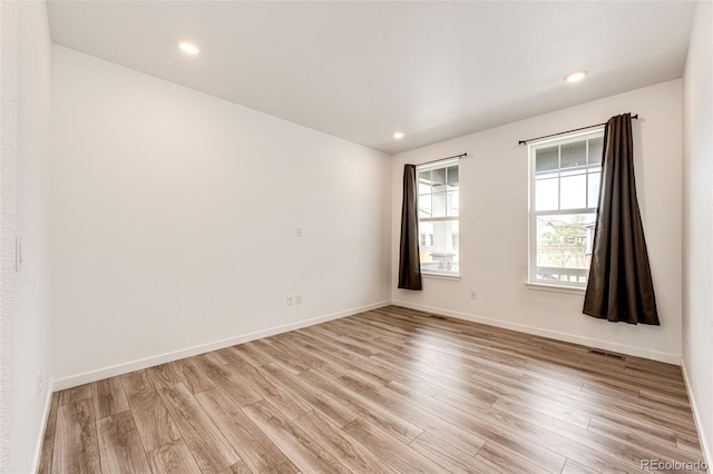 985 S Elk Way, Aurora, CO 80018 - unfurnished room with light wood finished floors and recessed lighting