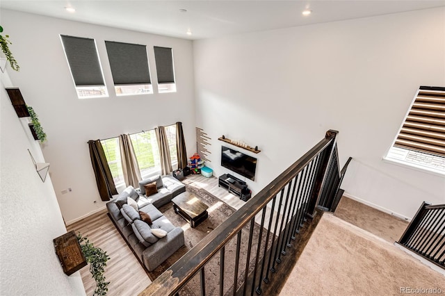 985 S Elk Way, Aurora, CO 80018 - living room with recessed lighting, a towering ceiling, and carpet flooring