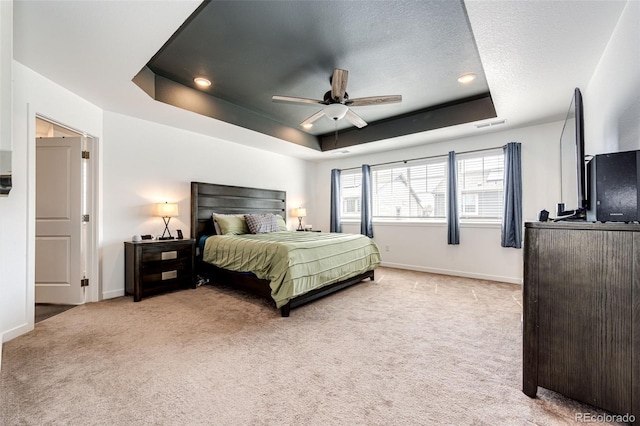 985 S Elk Way, Aurora, CO 80018 - bedroom with a tray ceiling, light colored carpet, ceiling fan, recessed lighting, and a textured ceiling