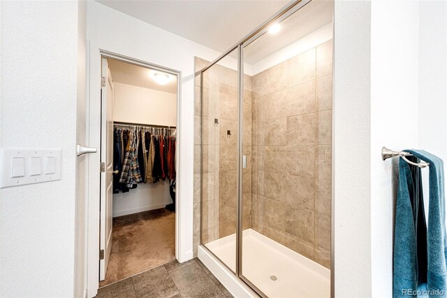 985 S Elk Way, Aurora, CO 80018 - full bathroom with a shower stall and a walk in closet