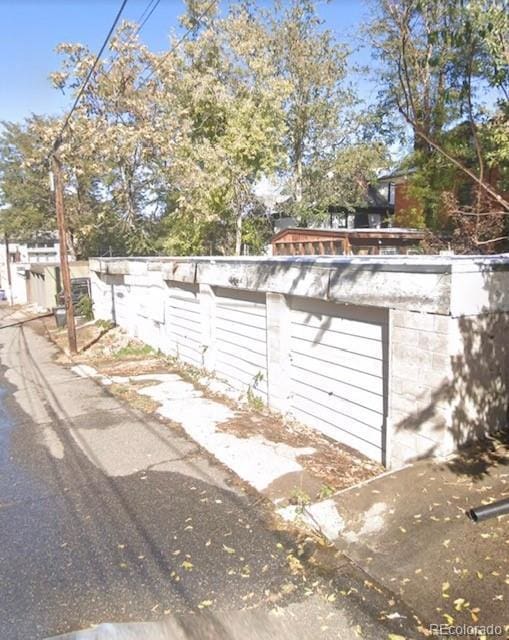 exterior space with a garage and an outdoor structure