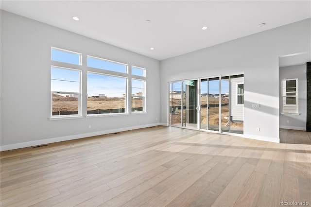 spare room with light wood-type flooring