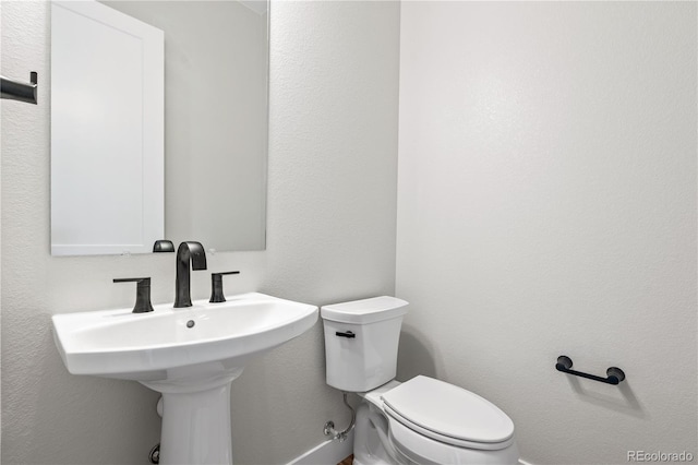 bathroom featuring toilet