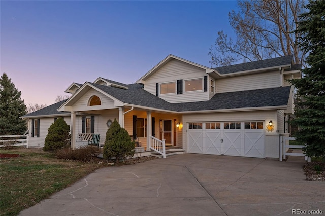 view of front of property featuring a porch and a garage