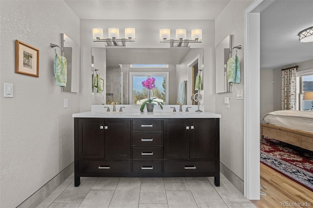 bathroom with vanity and tile patterned floors