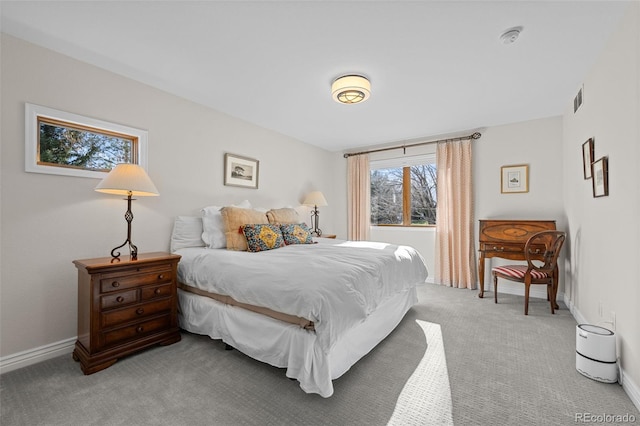 bedroom featuring light colored carpet