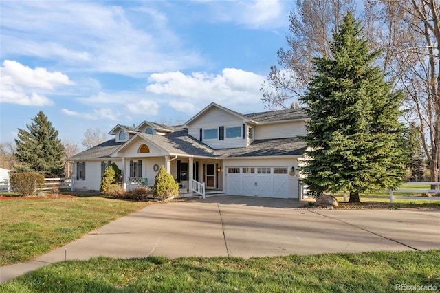 view of front of property with a garage and a front yard