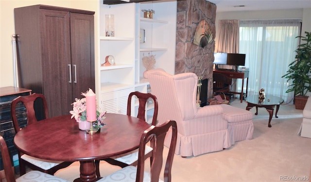 dining area with light carpet