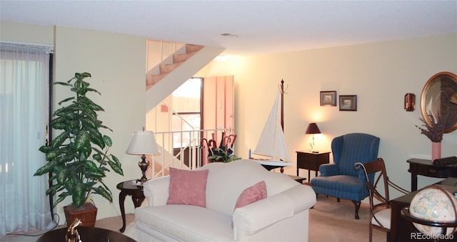 living room featuring light carpet