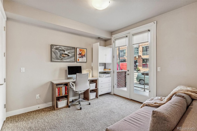 office area featuring baseboards, carpet flooring, and french doors