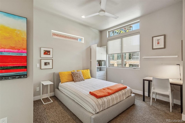 bedroom featuring a ceiling fan, baseboards, and carpet