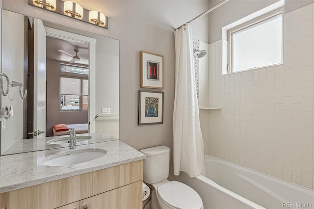 bathroom with toilet, shower / bath combination with curtain, and vanity