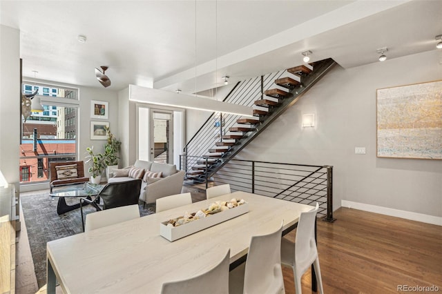 1012 Bannock St, Denver, CO 80204 - dining space featuring baseboards, wood finished floors, and stairway
