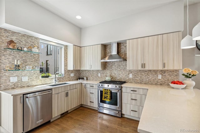 1012 Bannock St, Denver, CO 80204 - kitchen with wall chimney range hood, appliances with stainless steel finishes, a sink, and light brown cabinets