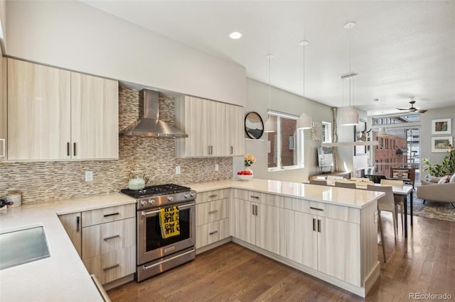 1012 Bannock St, Denver, CO 80204 - kitchen with gas stove, wall chimney range hood, modern cabinets, and light brown cabinetry