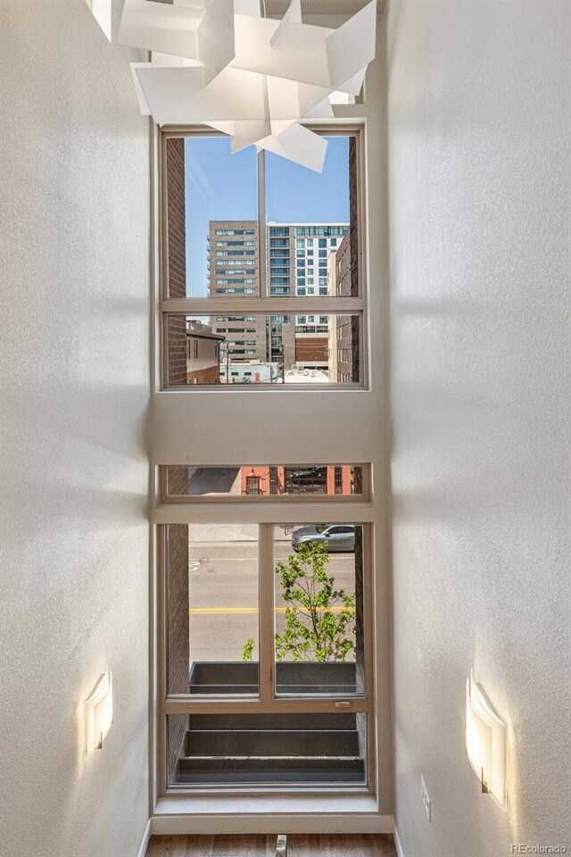 1012 Bannock St, Denver, CO 80204 - stairway with a textured wall and baseboards