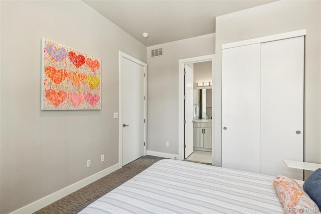 1012 Bannock St, Denver, CO 80204 - carpeted bedroom featuring baseboards, a closet, and connected bathroom