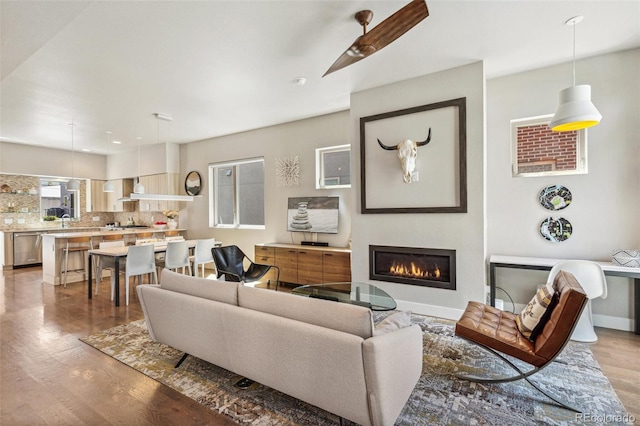 1012 Bannock St, Denver, CO 80204 - living room featuring wood finished floors and a glass covered fireplace