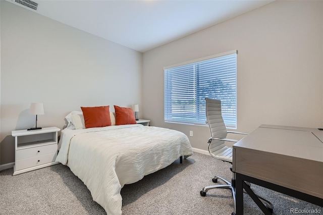 bedroom featuring light colored carpet