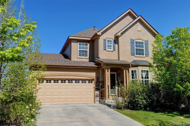 7081 S Oak Hill Cir, Aurora, CO 80016 - traditional home with concrete driveway, stucco siding, and stone siding