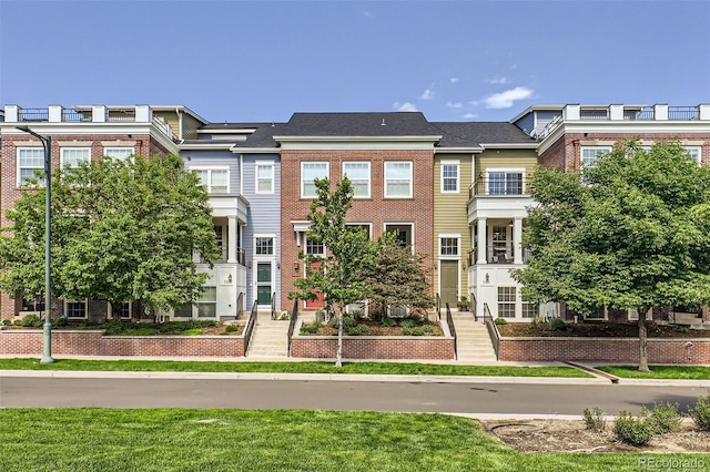 3411 N Xenia St, Denver, CO 80238 - view of property with brick siding