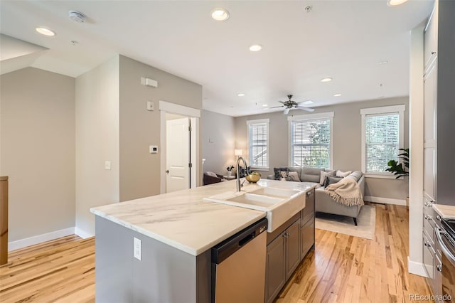 3411 N Xenia St, Denver, CO 80238 - kitchen with appliances with stainless steel finishes, light wood finished floors, recessed lighting, open floor plan, and ceiling fan