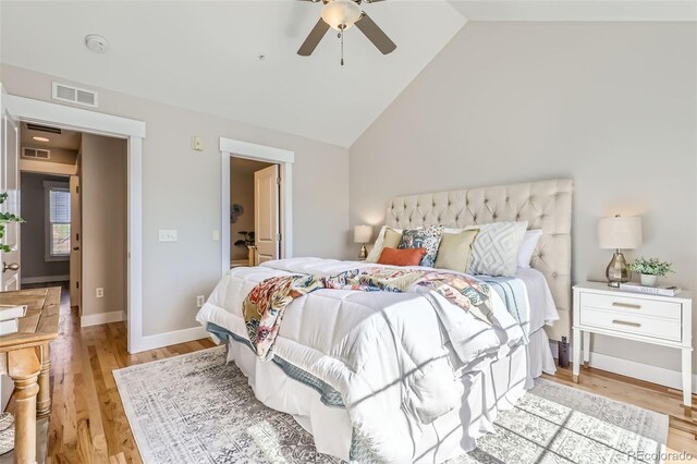 3411 N Xenia St, Denver, CO 80238 - bedroom with light wood-style flooring, high vaulted ceiling, and ceiling fan