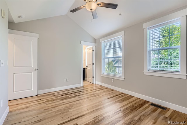 3411 N Xenia St, Denver, CO 80238 - unfurnished bedroom featuring light wood-style flooring, vaulted ceiling, connected bathroom, and a ceiling fan