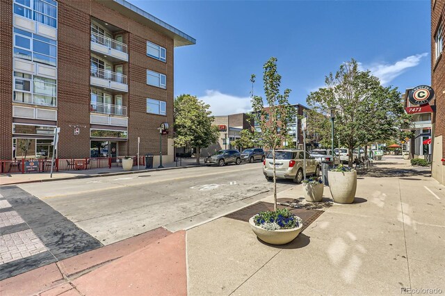 3411 N Xenia St, Denver, CO 80238 - view of asphalt road featuring sidewalks, street lighting, and curbs