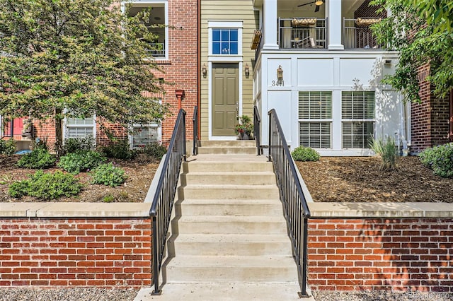 3411 N Xenia St, Denver, CO 80238 - property entrance featuring a balcony and brick siding