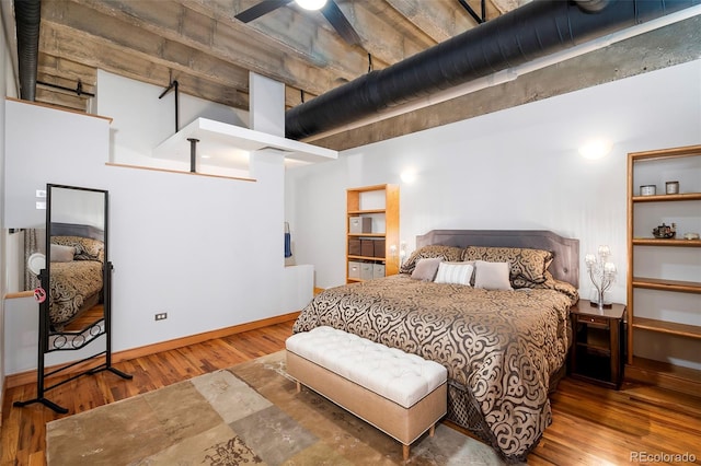 bedroom with ceiling fan and wood-type flooring