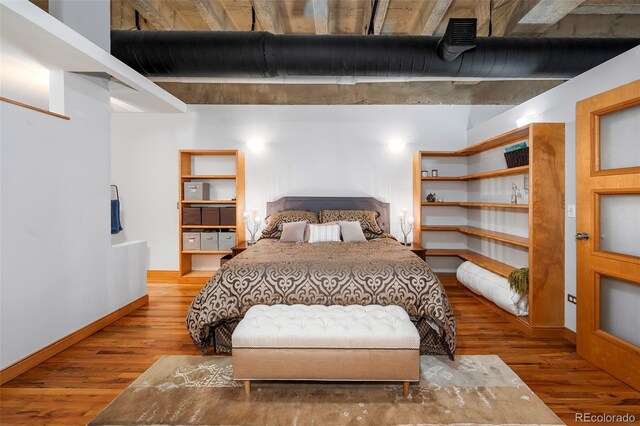 bedroom featuring hardwood / wood-style flooring