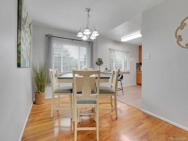2797 S Newton Way, Denver, CO 80236 - dining area featuring a chandelier and light wood-type flooring