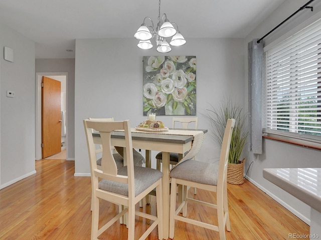 2797 S Newton Way, Denver, CO 80236 - dining area featuring a chandelier and light wood-type flooring