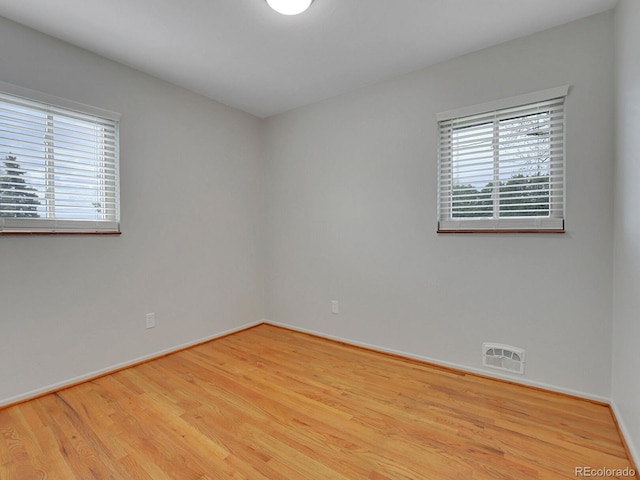 2797 S Newton Way, Denver, CO 80236 - empty room with wood finished floors and baseboards