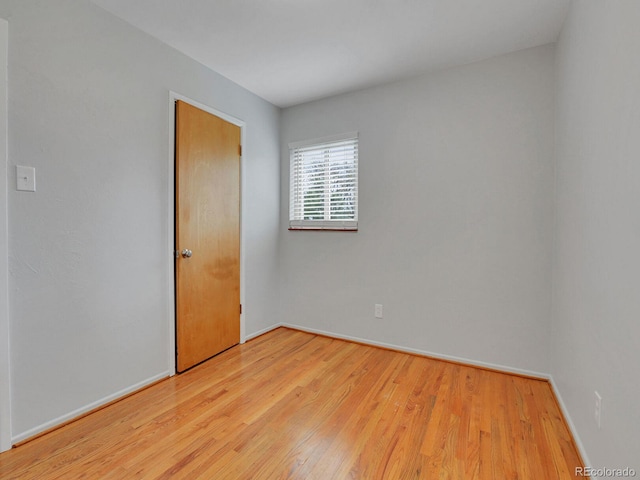 2797 S Newton Way, Denver, CO 80236 - spare room featuring wood finished floors and baseboards