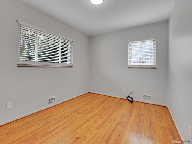 2797 S Newton Way, Denver, CO 80236 - spare room featuring wood finished floors and baseboards