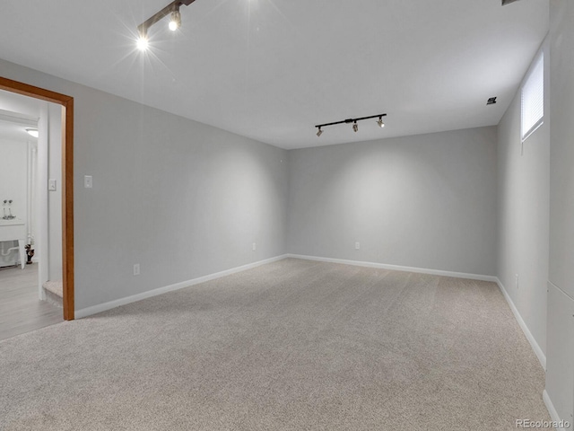 2797 S Newton Way, Denver, CO 80236 - carpeted empty room featuring track lighting and baseboards