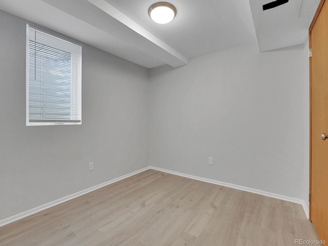 2797 S Newton Way, Denver, CO 80236 - below grade area featuring light wood-style floors and baseboards