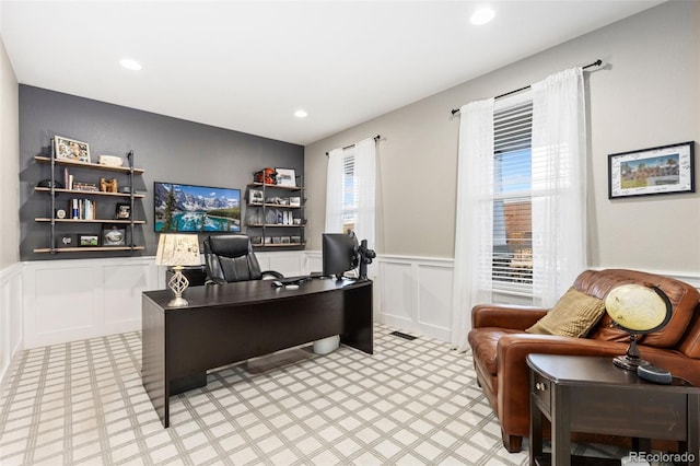 home office featuring recessed lighting, a wainscoted wall, and a decorative wall