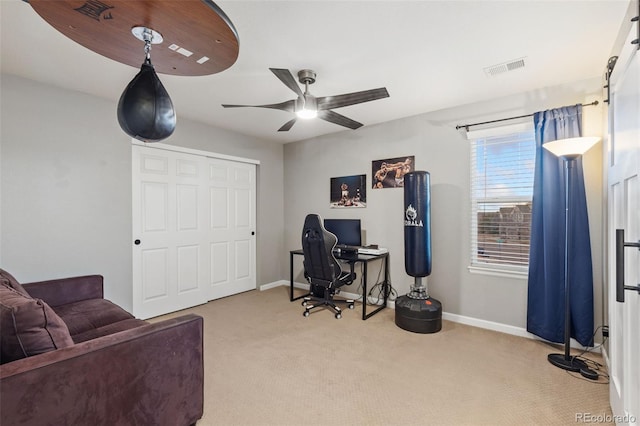 office with carpet floors, visible vents, baseboards, and a ceiling fan