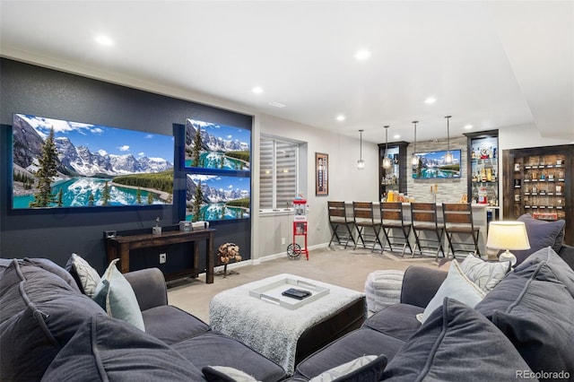 carpeted cinema room with wet bar, baseboards, and recessed lighting