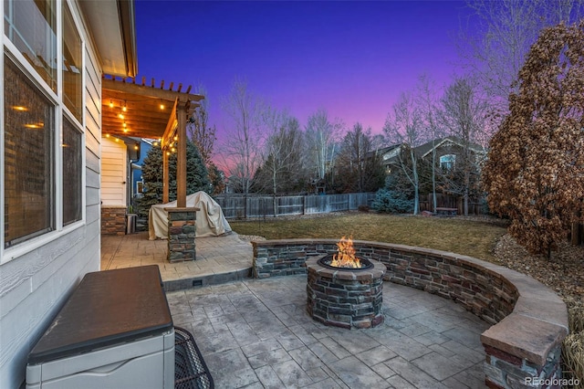 view of patio with a fire pit and a fenced backyard